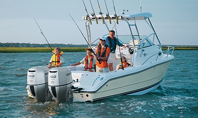 A fishing boat with two Honda outboards