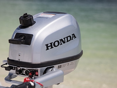 A close up of a Honda outboard unit 